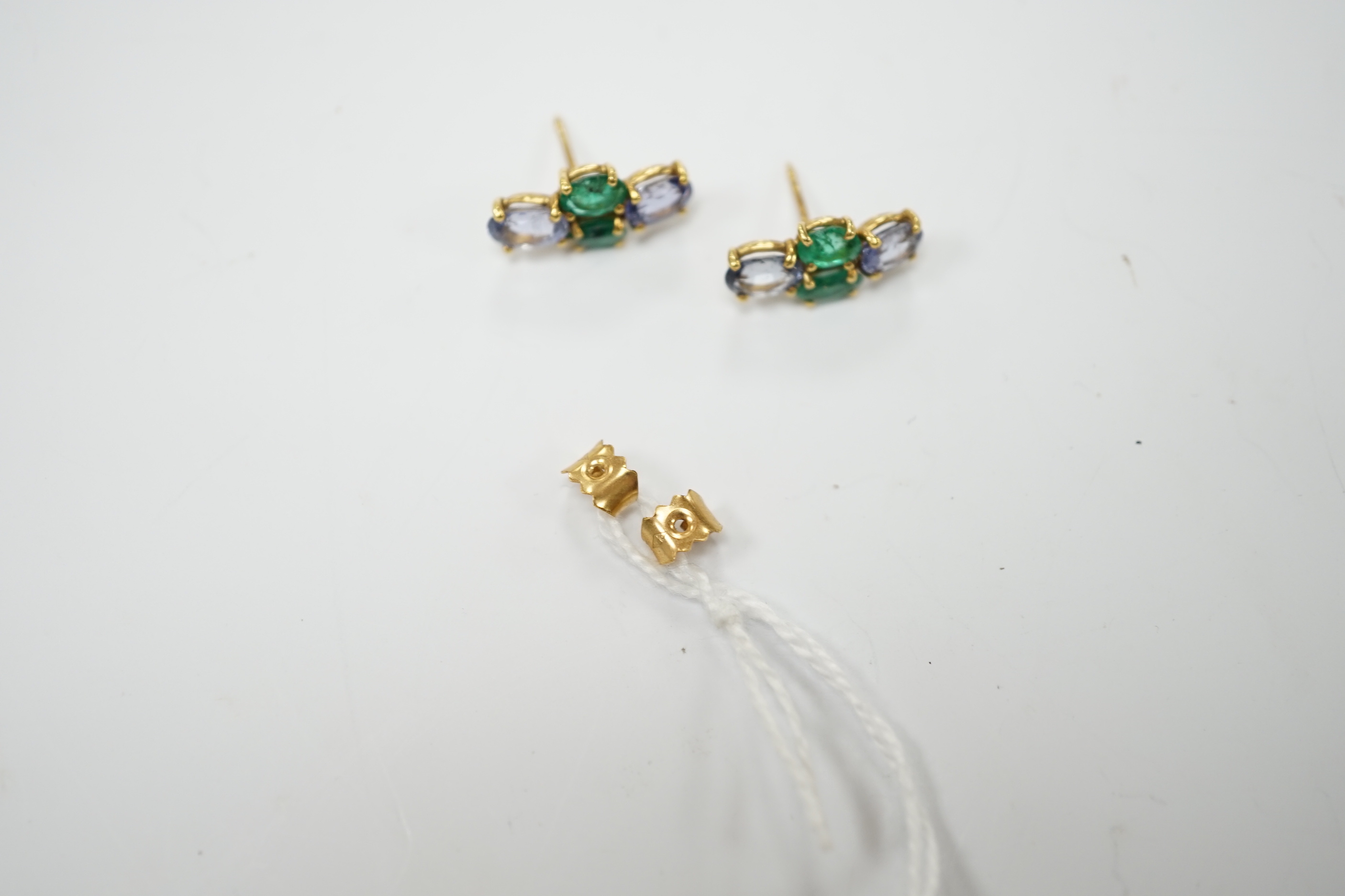 A modern pair of 18ct gold, two stone emerald and two stone sapphire set ear studs, 15mm by 7mm, - Image 4 of 4