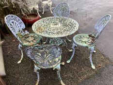 A Victorian style cast aluminium garden table, diameter 71cm, height 67cm, together with four