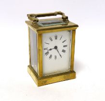 A cased brass carriage timepiece, 14cm high