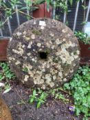 A circular millstone, diameter 58cm
