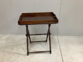 A late Victorian rectangular oak butler's tray on folding stand, width 65cm, depth 44cm, height