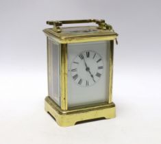 A brass carriage timepiece with enamel dial, 18cm high