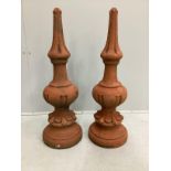 A pair of cast stone roof finials, height 72cm