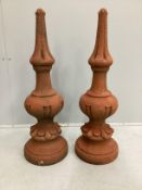 A pair of cast stone roof finials, height 72cm