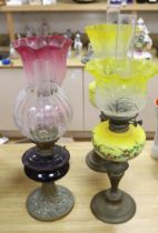 Four Victorian/Edwardian oil lamps with glass shades, tallest 69cm
