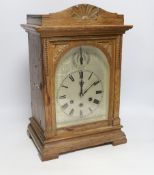 A 1920's Gustav Becker oak bracket clock with three train movement, striking and chiming on five