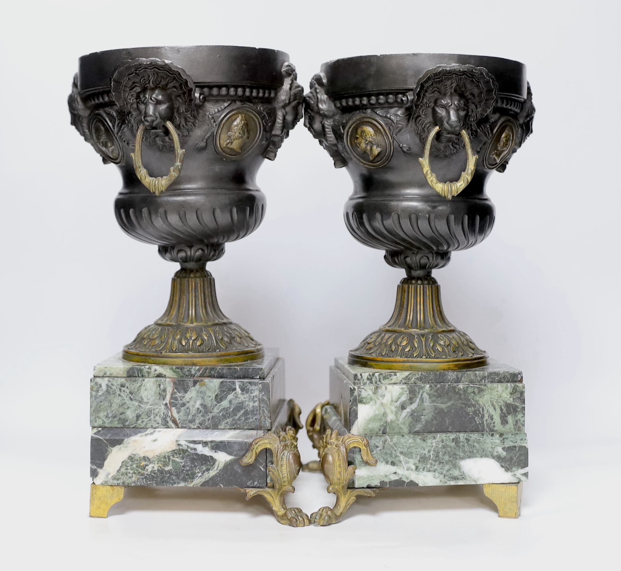 A pair of late 19th century French gilt metal and brown patinated urns, decorated with masks and - Image 2 of 3