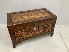 A Chinese carved camphorwood trunk, width 100cm, depth 52cm, height 60cm