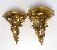 Two late 19th century Florentine rococo style giltwood wall brackets, largest 27cm long