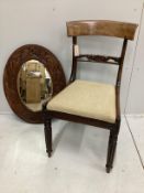 A William IV mahogany dining chair and a carved oak oval wall mirror, mirror width 67cm, height