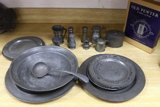 Pewter ware; a collection of plates, spoon cruet, jug, box, a large bowl, etc., bowl 34cm