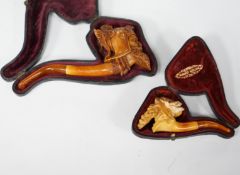 Two cased novelty Meerschaum pipes, their bowls modelled as an Arthurian knight and another a