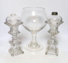 A pair of Victorian glass lamp bases and a goblet vase, largest 30cm