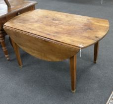 A 19th century French oval cherry drop flap kitchen table, width 136cm, depth 134cm extended, height