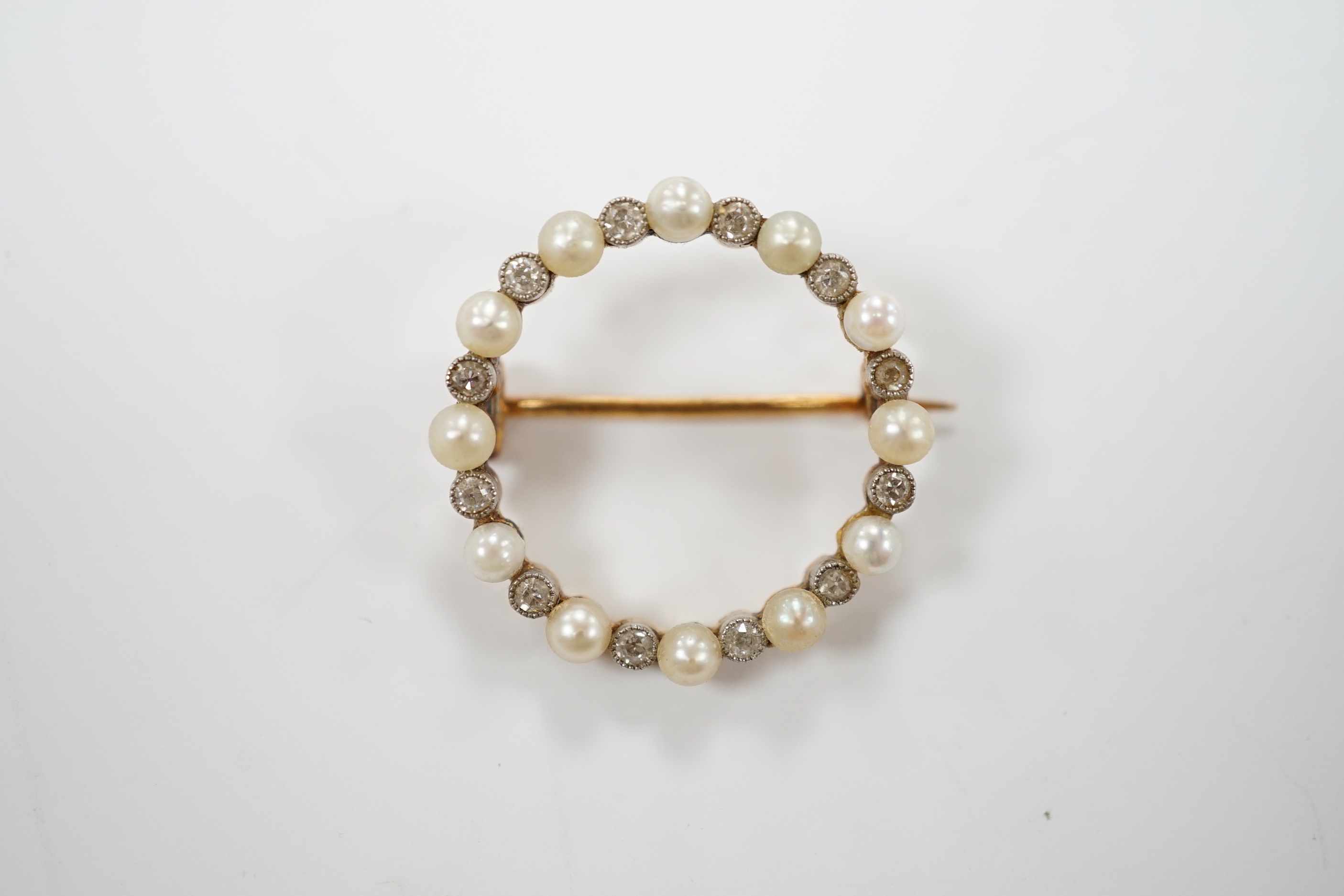 An Edwardian yellow metal, seed pearl and diamond chip set circular open work brooch, 22mm, gross - Image 2 of 3