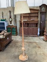 A carved pine standard lamp, height including shade 180cm, together with a smaller gilt metal