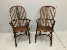 A near pair of mid 19th century Nottingham area ash and elm Windsor armchairs, larger width 53cm,
