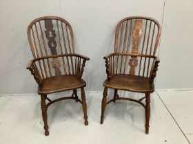 A near pair of mid 19th century Nottingham area ash and elm Windsor armchairs, larger width 53cm,