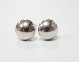 A modern pair of button shaped platinum ear studs, one butterfly missing, 1.1 grams.