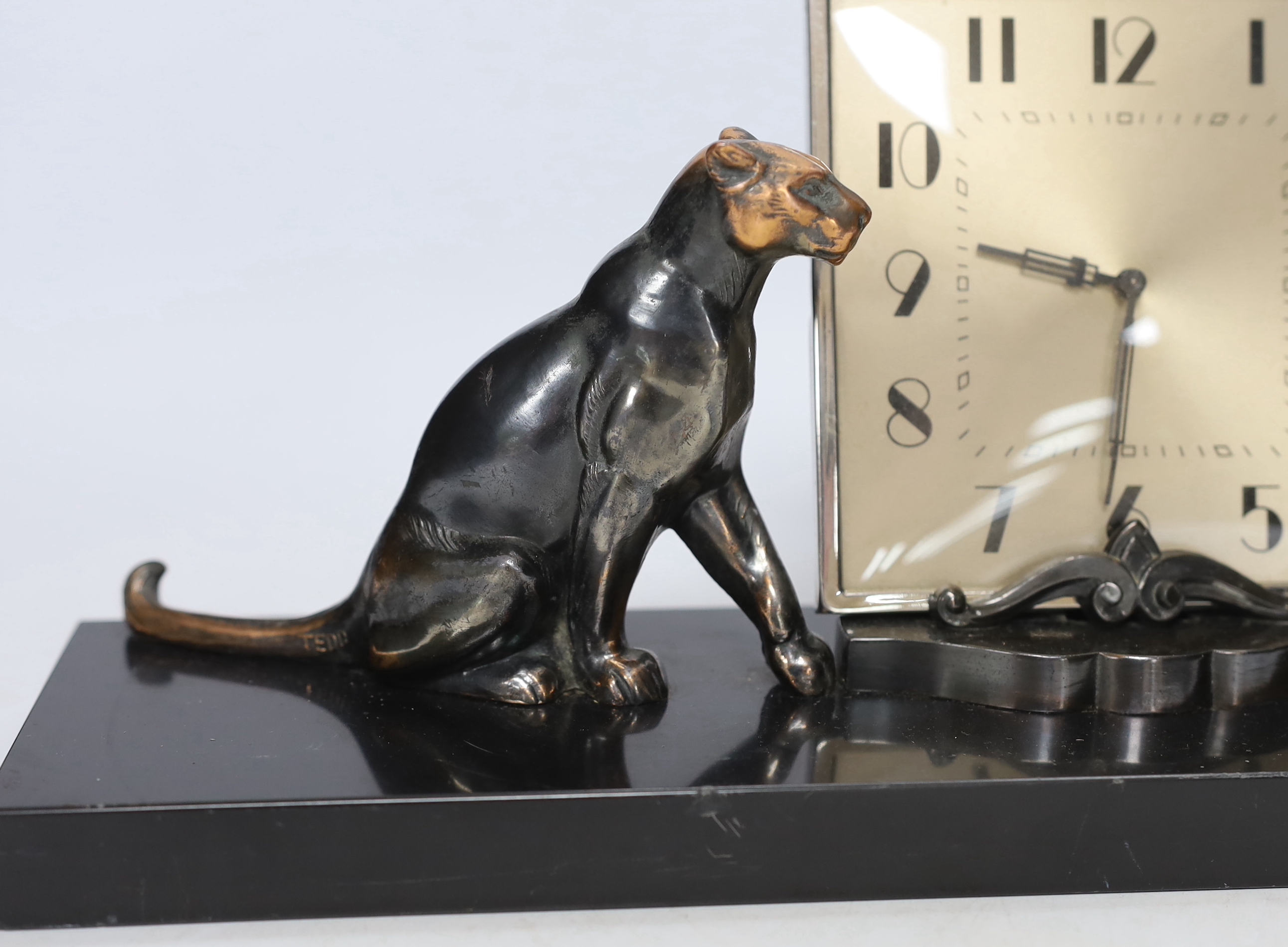 A patinated spelter Art Deco clock surmounted with two panthers, 40cm high - Image 2 of 4