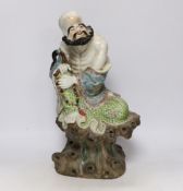 A Chinese enamelled porcelain figure of a luohan, 38cm high