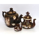 Three 19th century various sized Measham Barge ware teapots, largest 22cm high