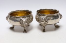 A pair of George II silver bun salts, with lion mask knees, on paw feet, maker's mark rubbed,