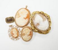 Two modern 9ct gold mounted oval cameo shell pendant brooches, largest 42cm and two other mounted