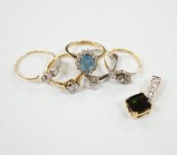 Five assorted modern 18ct and gem set rings, including two solitaire diamond rings and a graduated