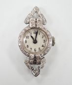 A mid 20th century white metal (inscribed platinum) and diamond cluster set Albion manual wind