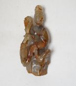 A Chinese carved agate group of Guanyin with a phoenix, 19th century, 17cm high