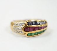 A modern 750, ruby, emerald, sapphire and diamond chip set three row ring, size I, gross weight 4.