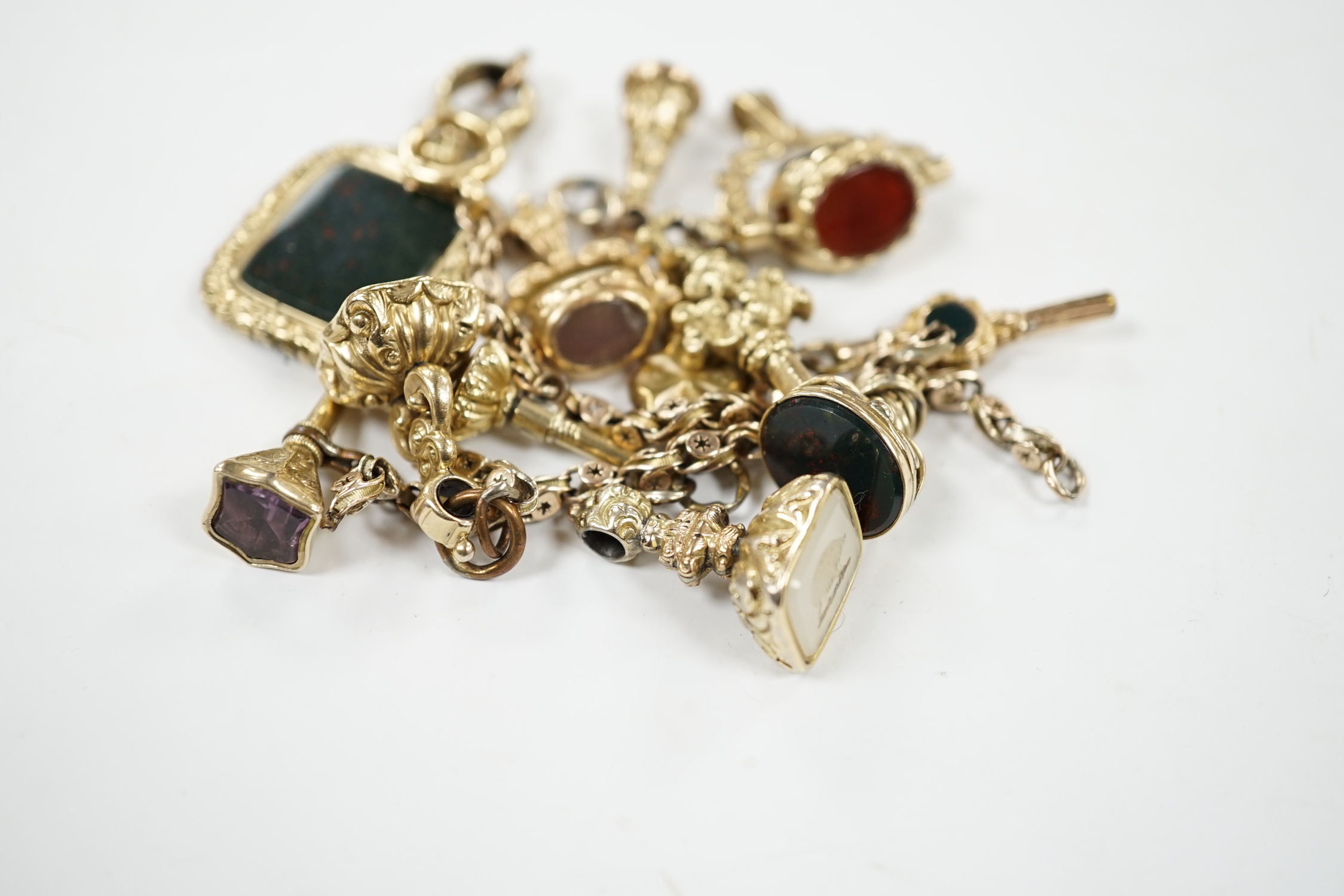 An early 20th century yellow metal charm bracelet (a.f.), hung with five assorted watch keys, - Image 3 of 4