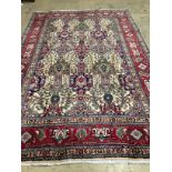 A Tabriz ivory ground carpet, 304 x 204cm