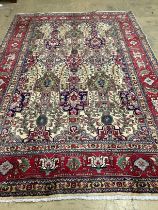 A Tabriz ivory ground carpet, 304 x 204cm