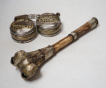 A pair of Georgian silver sugar tongs, a mounted bone implement and a pair of mixed metal bangles.