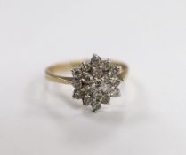 A modern 9ct gold and diamond cluster set flower head ring, size P/Q, gross weight 2.9 grams.