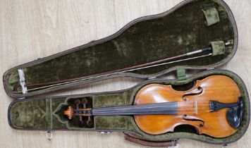 An early 19th century cased Italian violin labelled Florentus Florenus, body length 35cm, with a