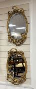 A pair of Victorian oval giltwood and composition girandole wall mirrors, width 34cm, height 55cm