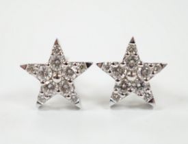 A modern pair of 18ct white gold and diamond chip star shaped ear studs, 10mm, gross weight 2.2