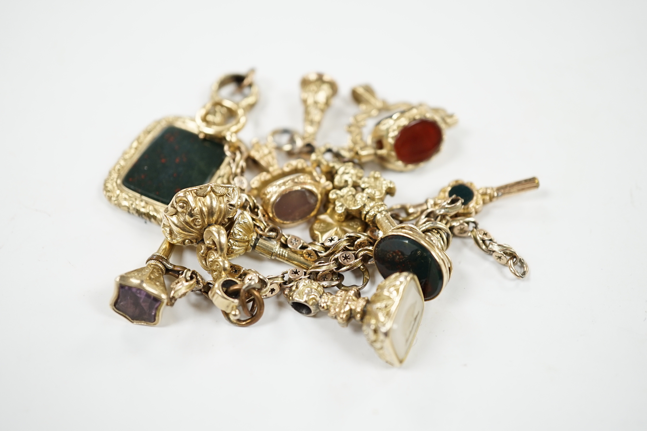 An early 20th century yellow metal charm bracelet (a.f.), hung with five assorted watch keys, - Image 4 of 4
