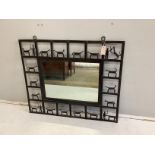 A rectangular wrought and cut metal wall mirror by Frederick Weinberg, width 92cm, height 77cm