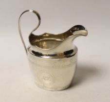 An early 19th century Irish engraved silver cream jug, crowned harp mark only, 13cm, 4.5oz.