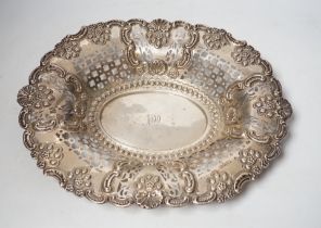 An Edwardian pierced silver oval dish, with shell and scroll border, by Nathan & Hayes, Chester,