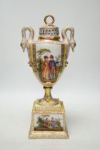 A Dresden yellow ground vase and cover with swan handles and figural cartouche, 36cm high