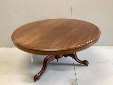 A Victorian circular mahogany tilt top breakfast table, diameter 134cm, height 71cm, together with a