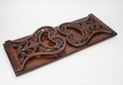A 19th century rosewood book slide with fretted sides, base 39cm wide