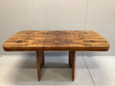 An Art Deco figured walnut rectangular extending dining table, length 167cm extended, one spare