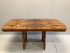 An Art Deco figured walnut rectangular extending dining table, length 167cm extended, one spare