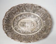 An early 20th century German 800 standard pierced white metal oval dish, decorated with putti and